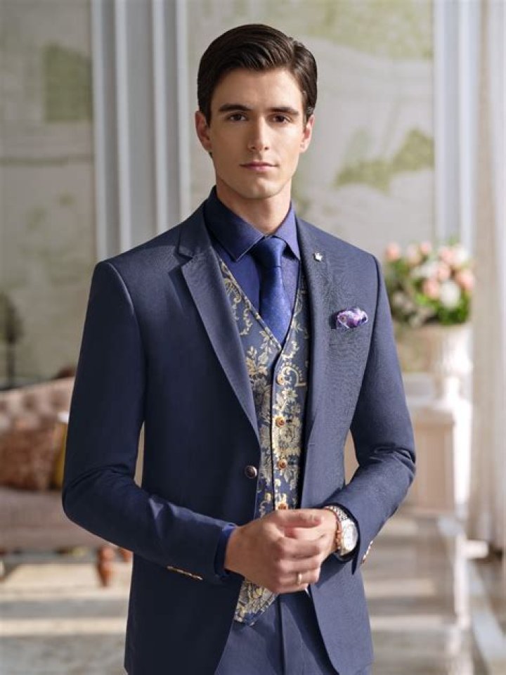 12 dapper men's wedding suits: Blue, black, cream & more