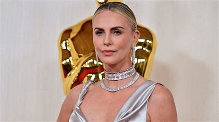 Charlize Theron is a goddess in pink silk Dior gown as she steps out on Oscars 2024 red carpet