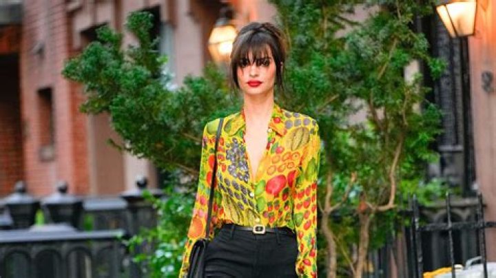 Emily Ratajkowski nails transitional dressing in ultra-vibrant tropical print shirt - see photos