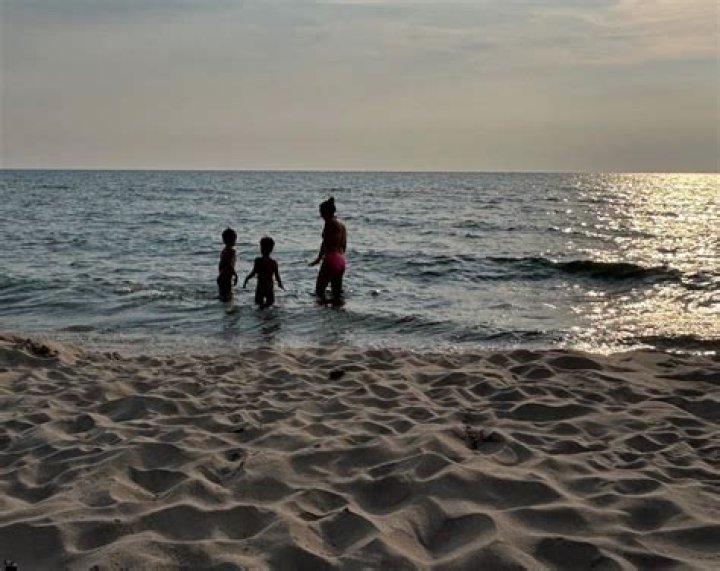 Ginger Zee stuns in sun-soaked lakeside photo with rarely-seen sons – and they're so grown up