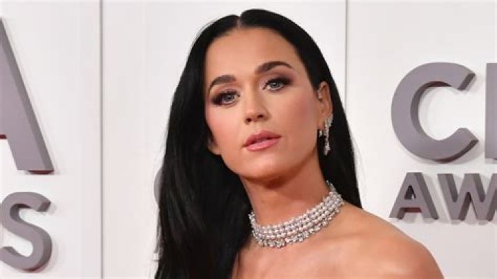 Katy Perry celebrates in drop-dead gorgeous waist-cinching holiday gown with a family photo
