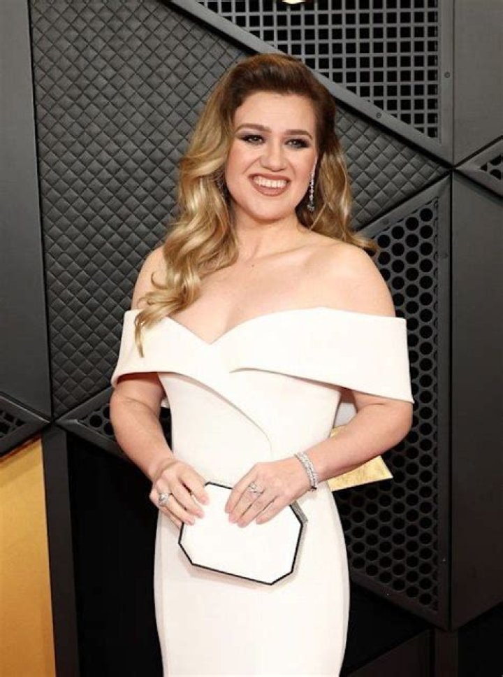 Kelly Clarkson looks phenomenal in figure-hugging Grammys gown alongside adorable lookalike son Remy