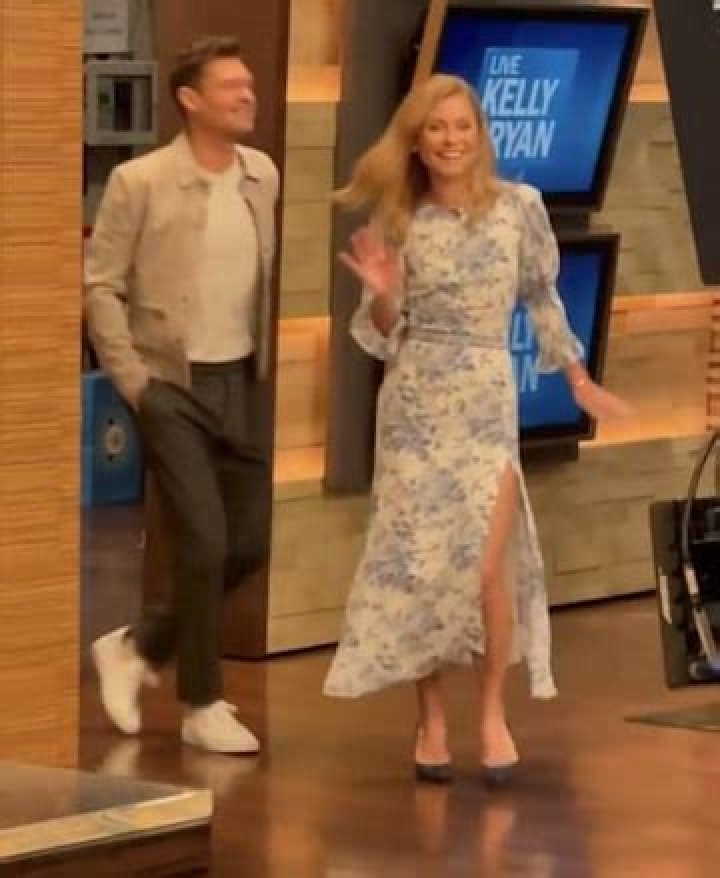 Kelly Ripa nearly suffers a wardrobe malfunction in a figure-flattering dress with a daring slit