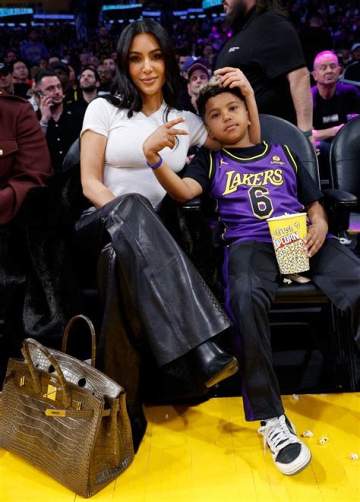 Kim Kardashian poses with son Saint, 8, courtside during Lakers game – see the sweet pics