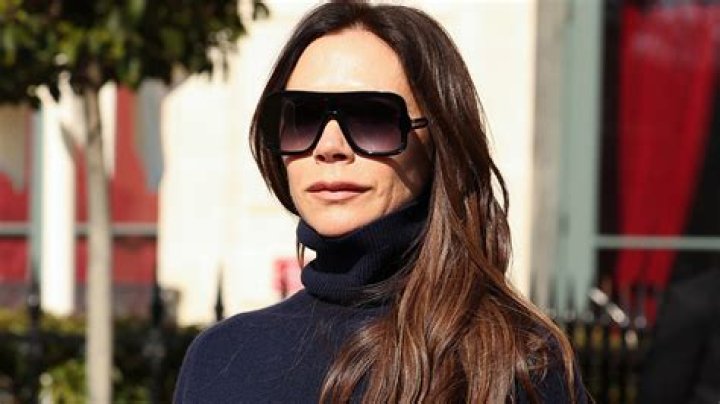 Posh swings into action on the set of her dress collection photo shoot