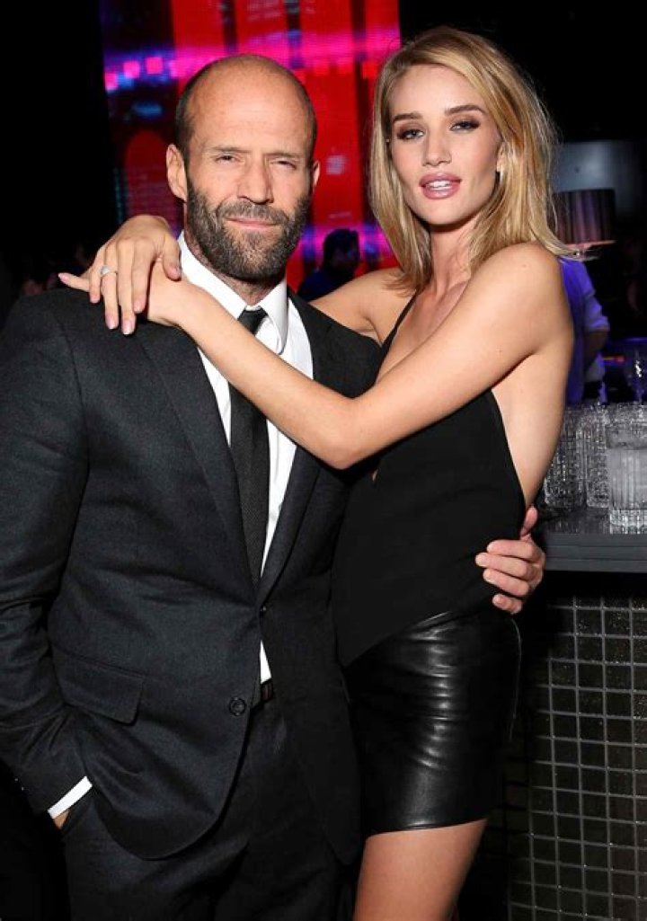 Rosie Huntington-Whiteley steals the show in a sexy short dress as she supports boyfriend Jason Statham