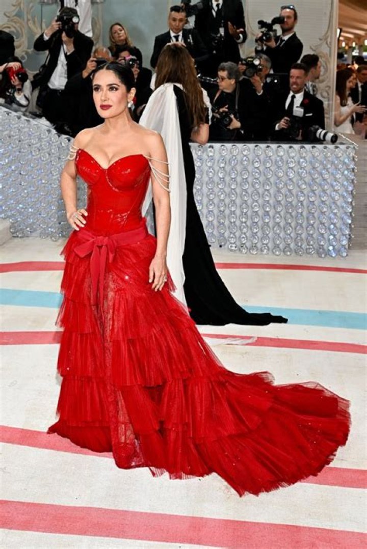 Salma Hayek almost bares all as she dances in just a bathrobe - watch